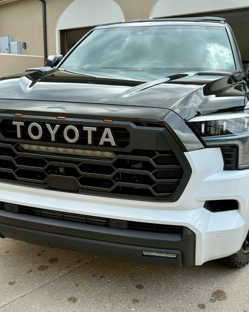 White Toyota Sequoia TRD Pro front end after a detail, black grille lettering clean